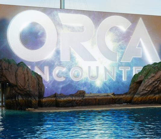 An Orca Encounter (reader contribution) Brightly lit Orca Encounter promotional sign at Sea World, San Diego