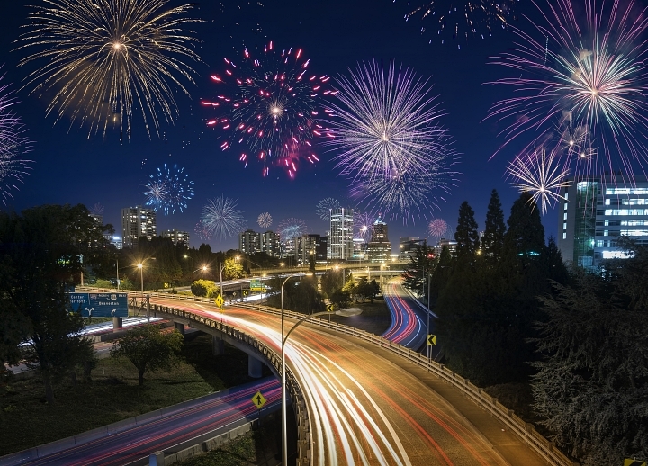 Fourth of July fireworks as seen from a motorist driving down the freeway