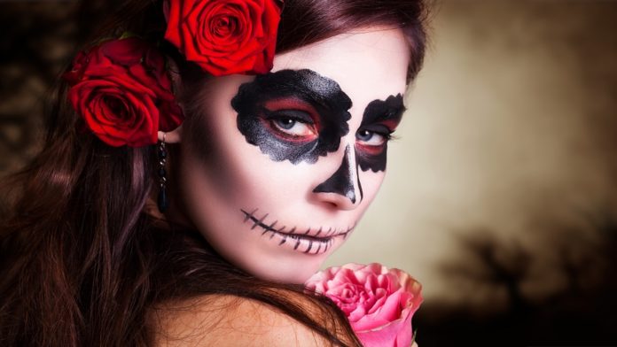 Young girl dressed like corpse for Day of the Dead festival